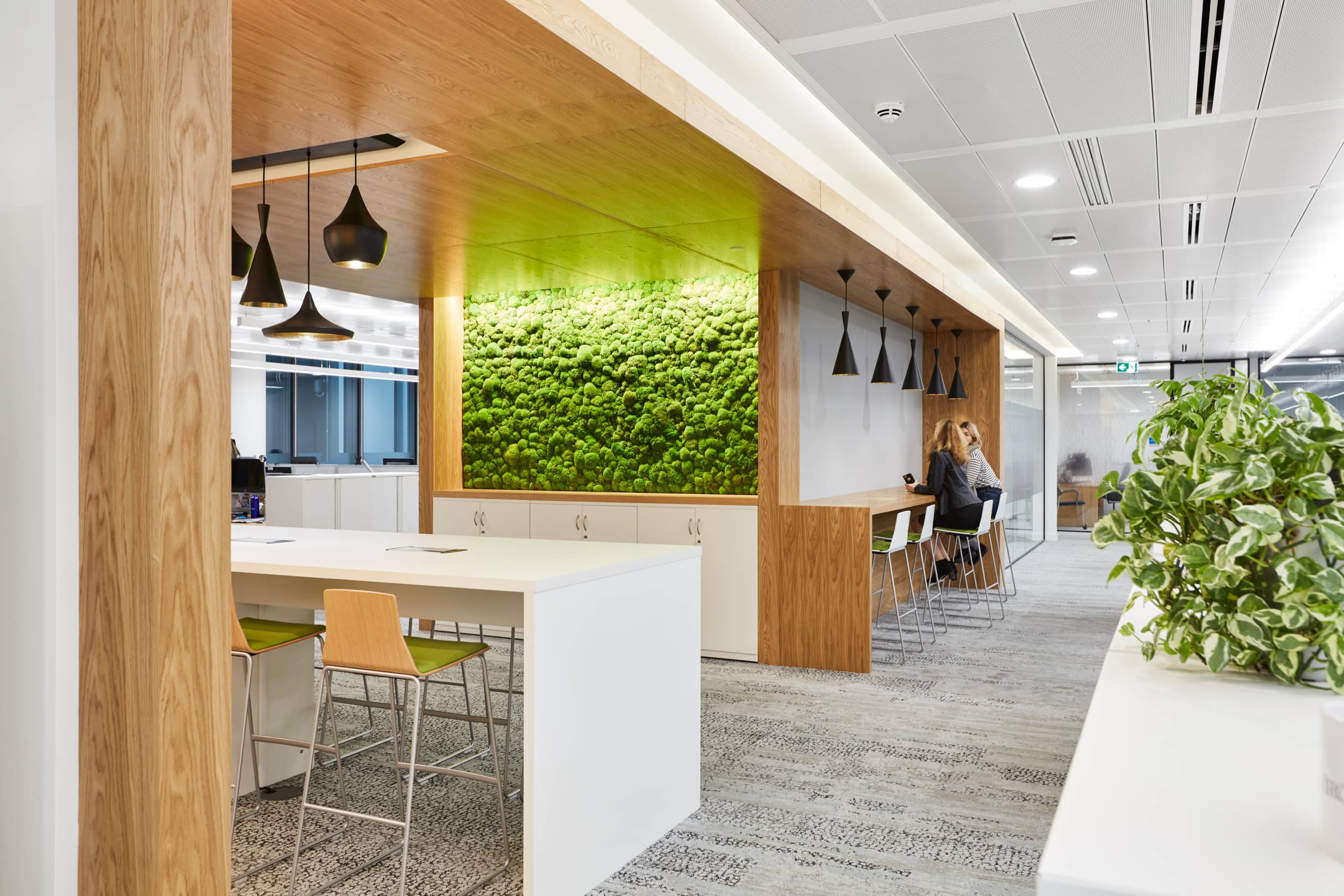 A moss feature wall is a feature near an employee breakout space within the Iron Mountain offices designed and built by AIS.