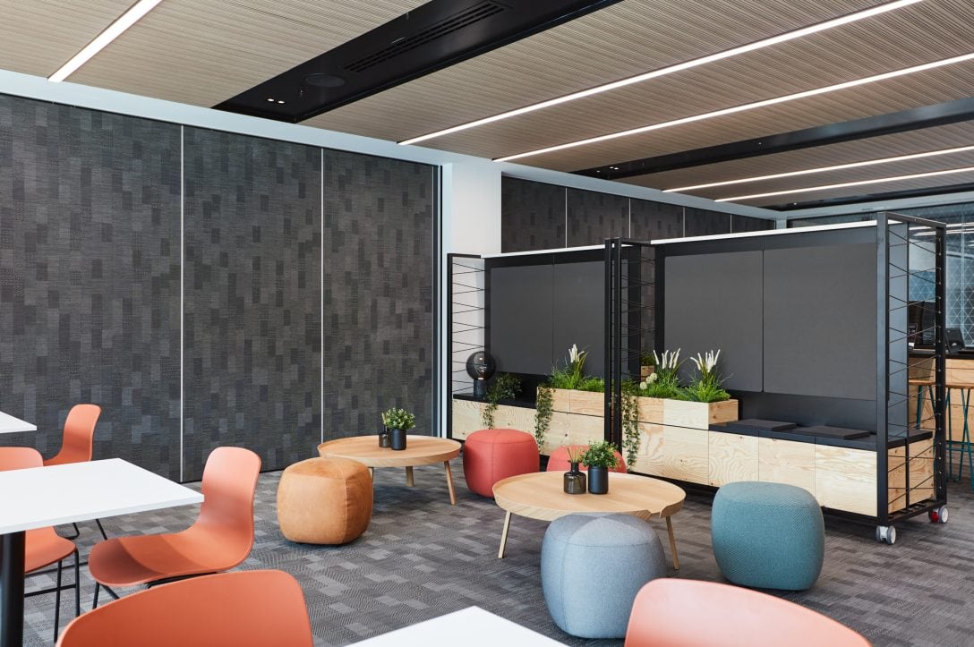 An office breakout space with multiple types of furniture allows for activity based working. 